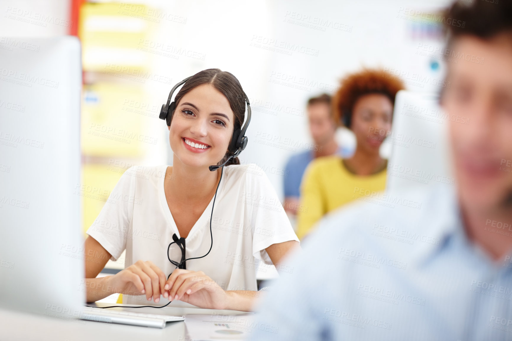 Buy stock photo Cropped portrait of an attractive young call center operator in the office