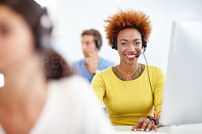 Buy stock photo Cropped shot of colleagues working in a call center