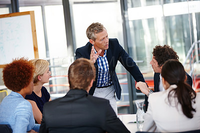 Buy stock photo Cropped shot of a group of business professionals in an office meeting