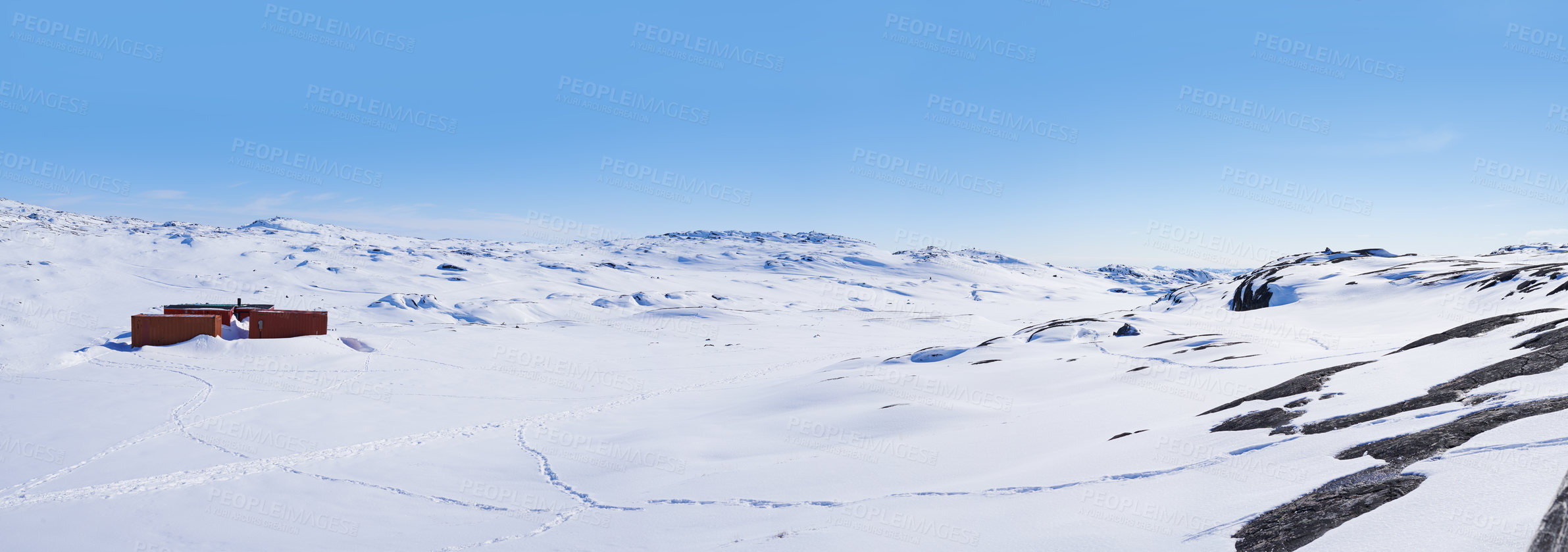 Buy stock photo Landscape, building and snow in winter or nature with sunshine, blue sky and mountain. House, iceberg and park in Arctic for background, wallpaper and travel to North Pole for adventure and hiking