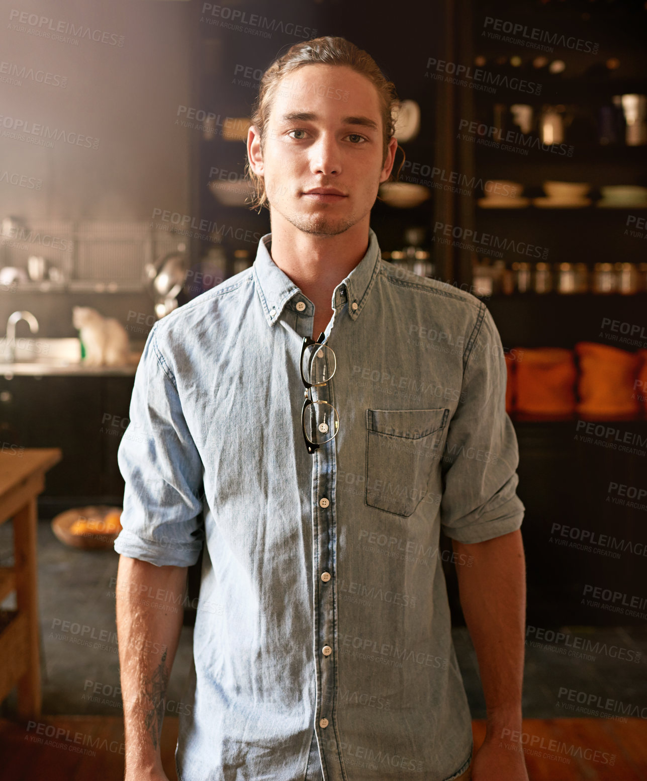 Buy stock photo Portrait of a handsome young man standing in his kitchen