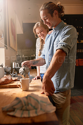 Buy stock photo Cropped shot of a young couple in the kitchen