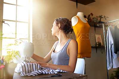 Buy stock photo A young designer making a garment in her workplace
