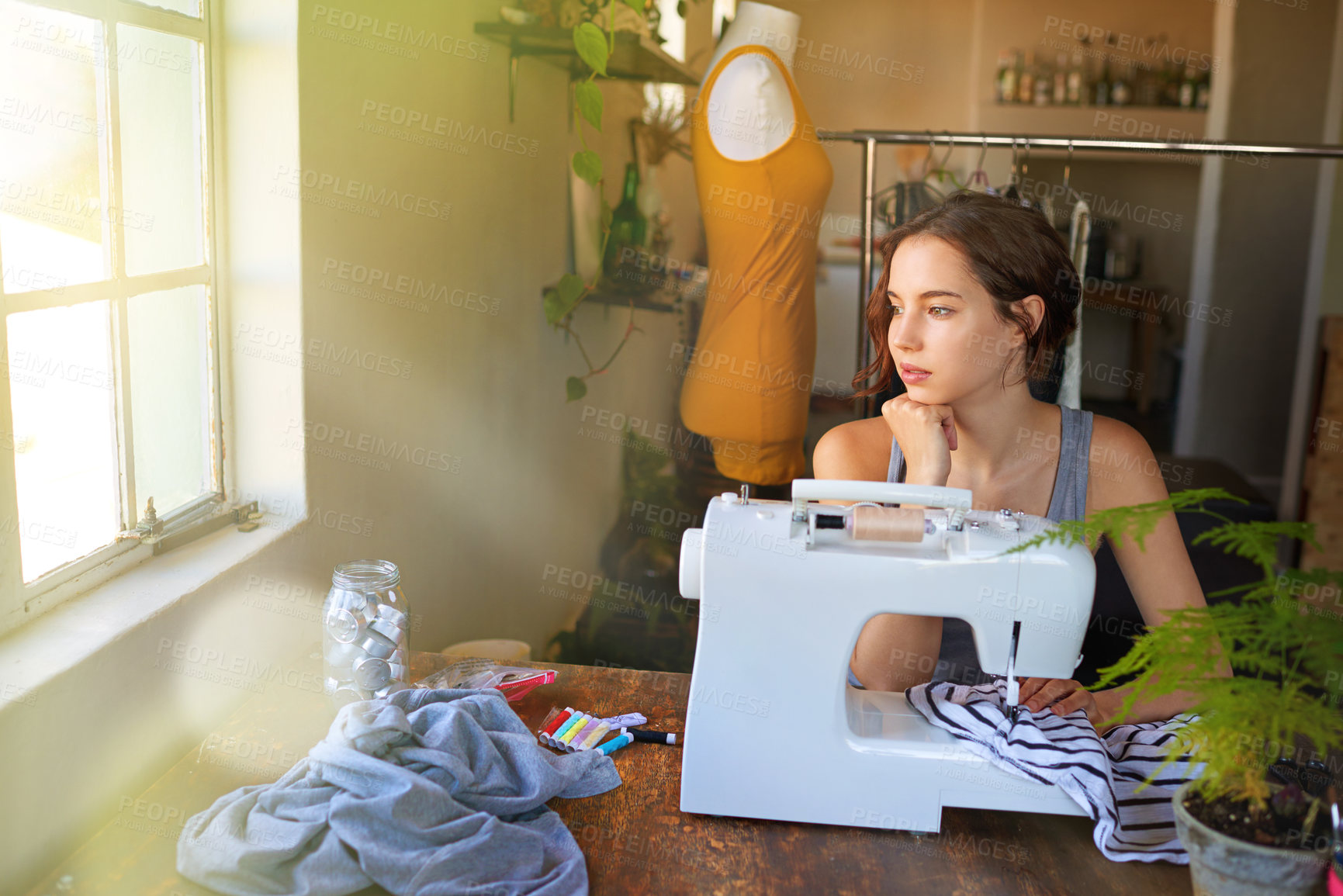 Buy stock photo A young designer making a garment in her workplace