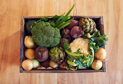 Buy stock photo Shot of a variety of vegetables in a crate on a table
