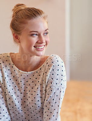 Buy stock photo Shot of a smiling young woman at home