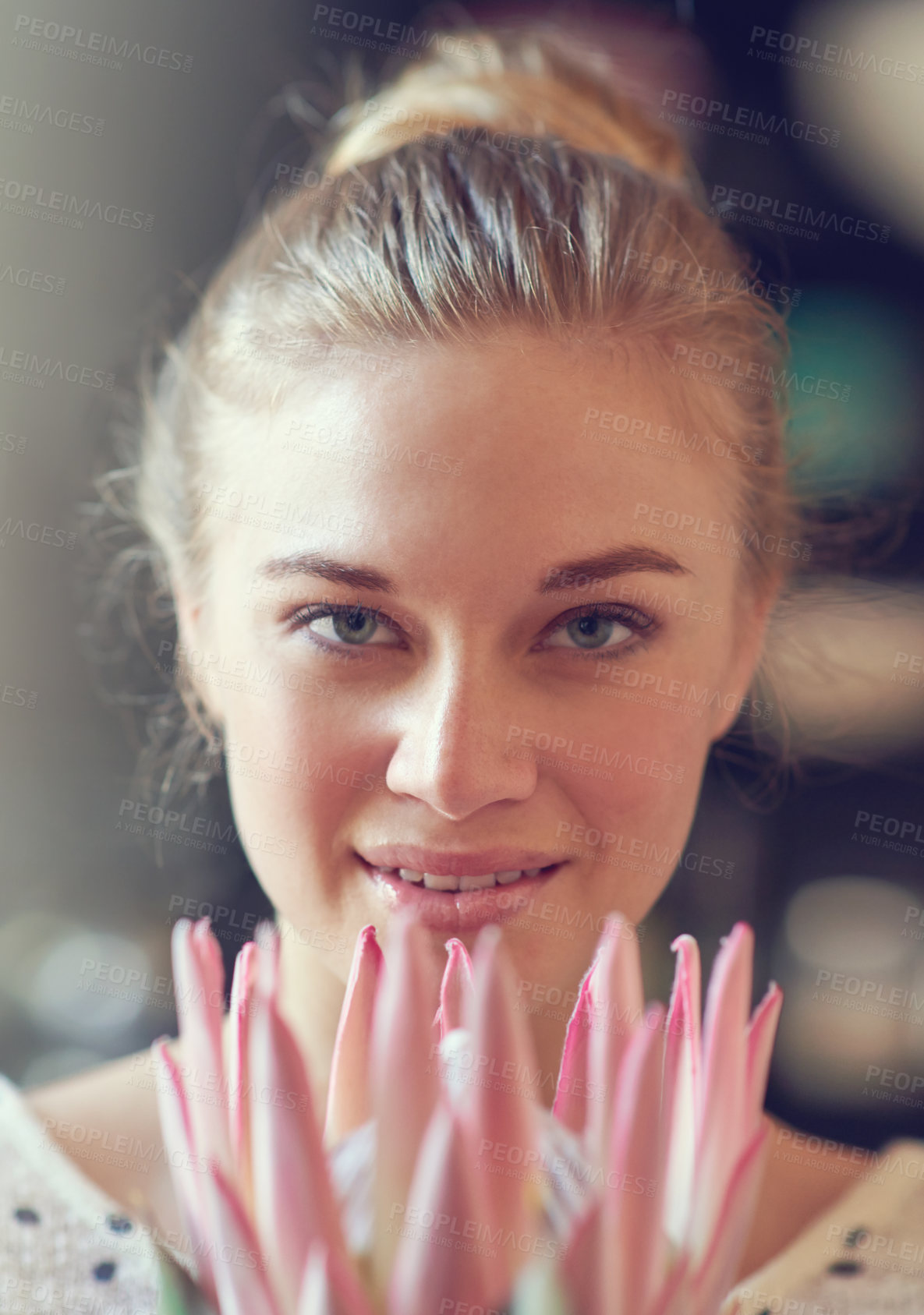 Buy stock photo Kitchen, portrait and woman with protea flower for surprise, present and gift for valentines day. Home, female person and smile with floral arrangement for decoration, bouquet and colorful plant