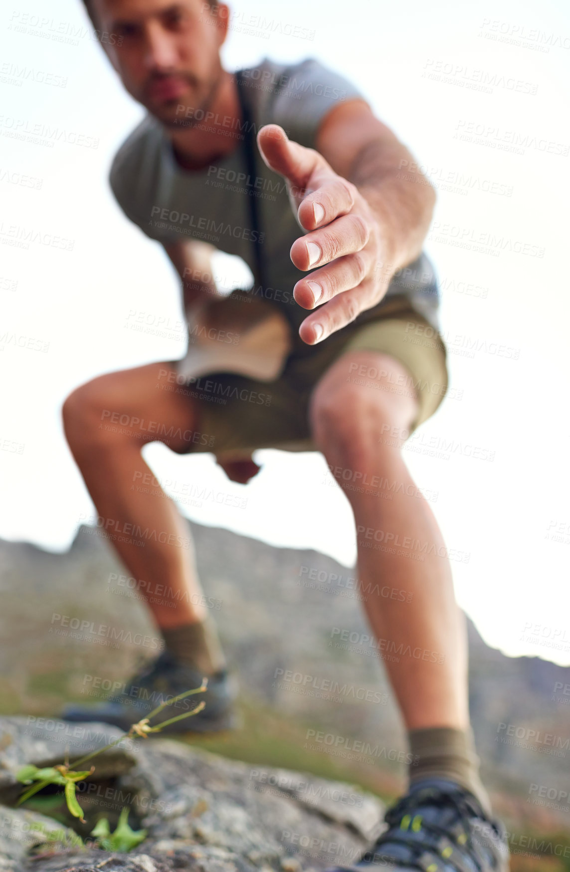 Buy stock photo Portrait, climbing and man with helping hand on mountain for travel, reach or holiday in pov. Trekking, outdoor and hiker with support, assistance offer or rescue on adventure on Alps in Switzerland