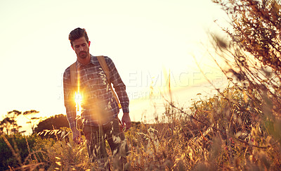 Buy stock photo Tourist, hiking and sunset with mountain, thinking and nature for travel journey and sightseeing. Man, backpacker and vacation for rest, relax and destination with adventure or summer holiday view