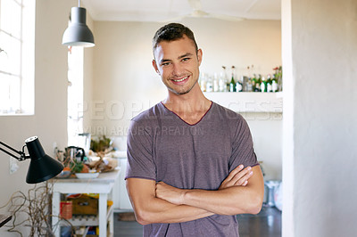 Buy stock photo Portrait of a handsome young man enjoying a day at home
