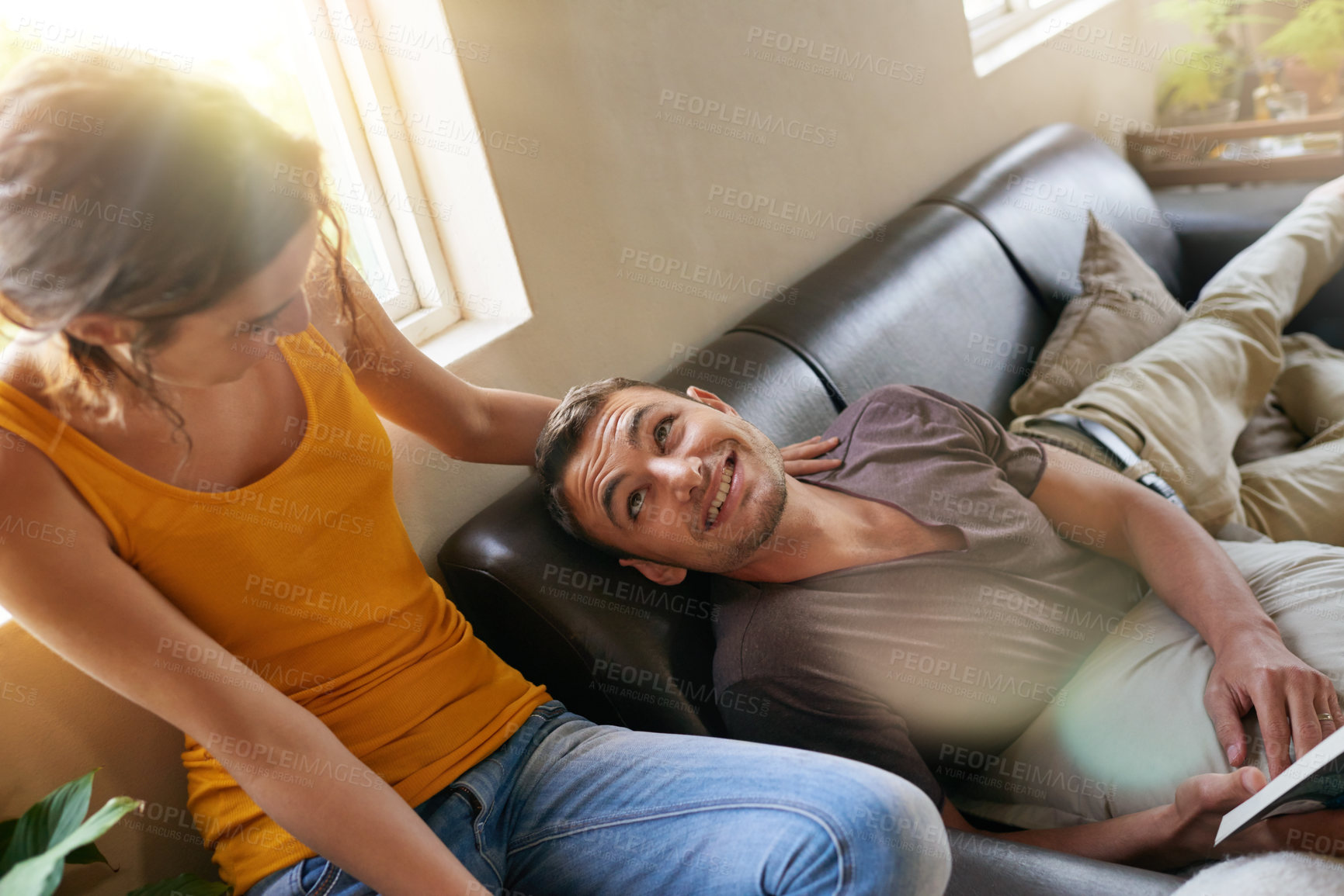 Buy stock photo Relax, bonding and couple on sofa in home together reading book for hobby in living room. Happy, connection and young man and woman resting and enjoying story, novel or literature in lounge at house.