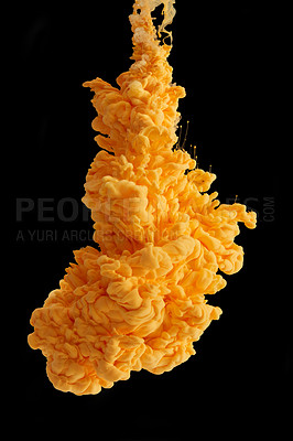 Buy stock photo Studio shot of yellow ink in water against a black background