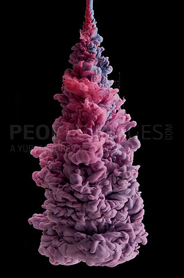 Buy stock photo Studio shot of colourful ink in water against a black background