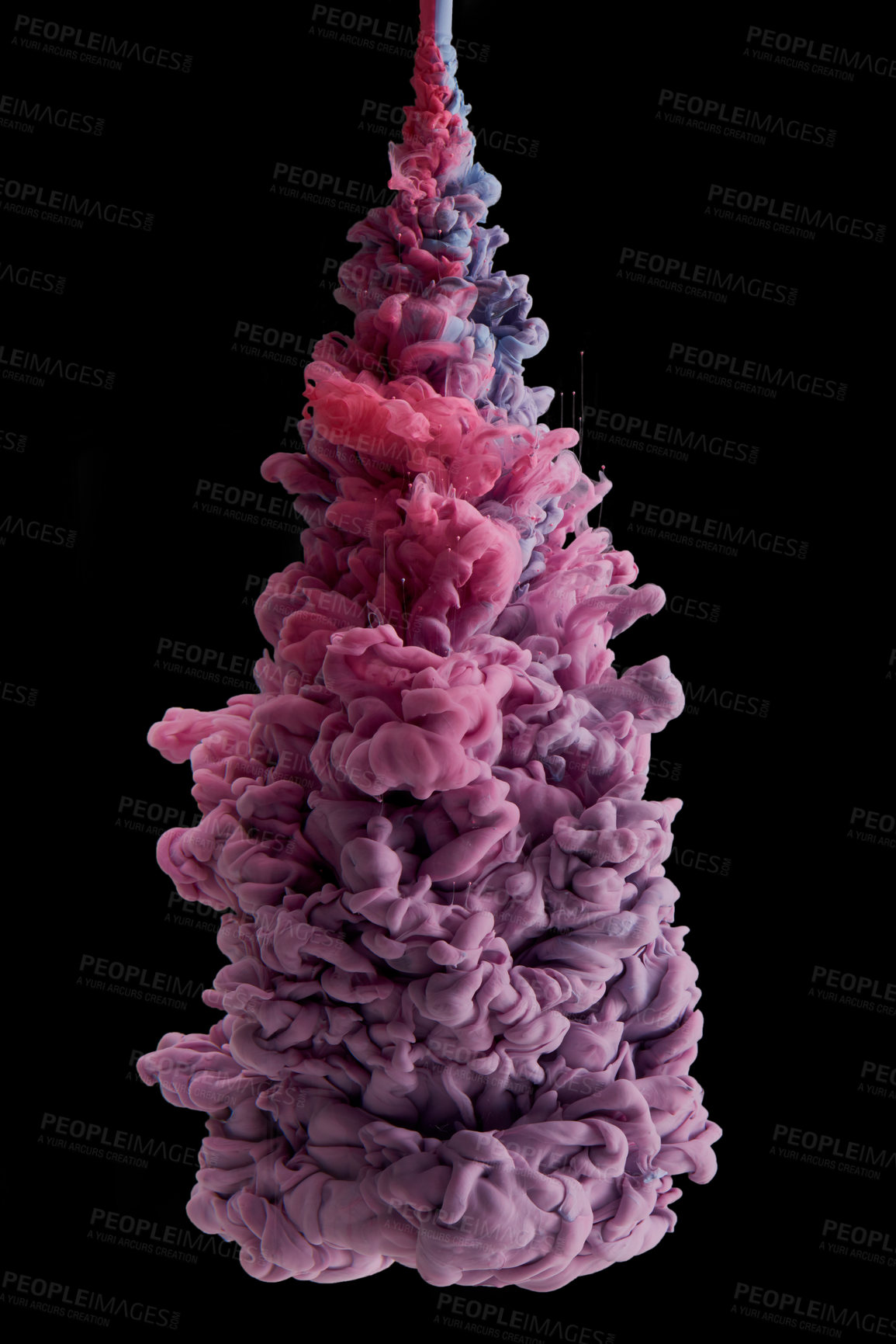 Buy stock photo Studio shot of colourful ink in water against a black background