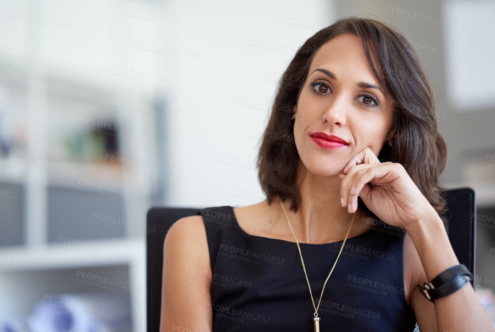 Buy stock photo Portrait of an attractive businesswoman sitting in a chair in an office