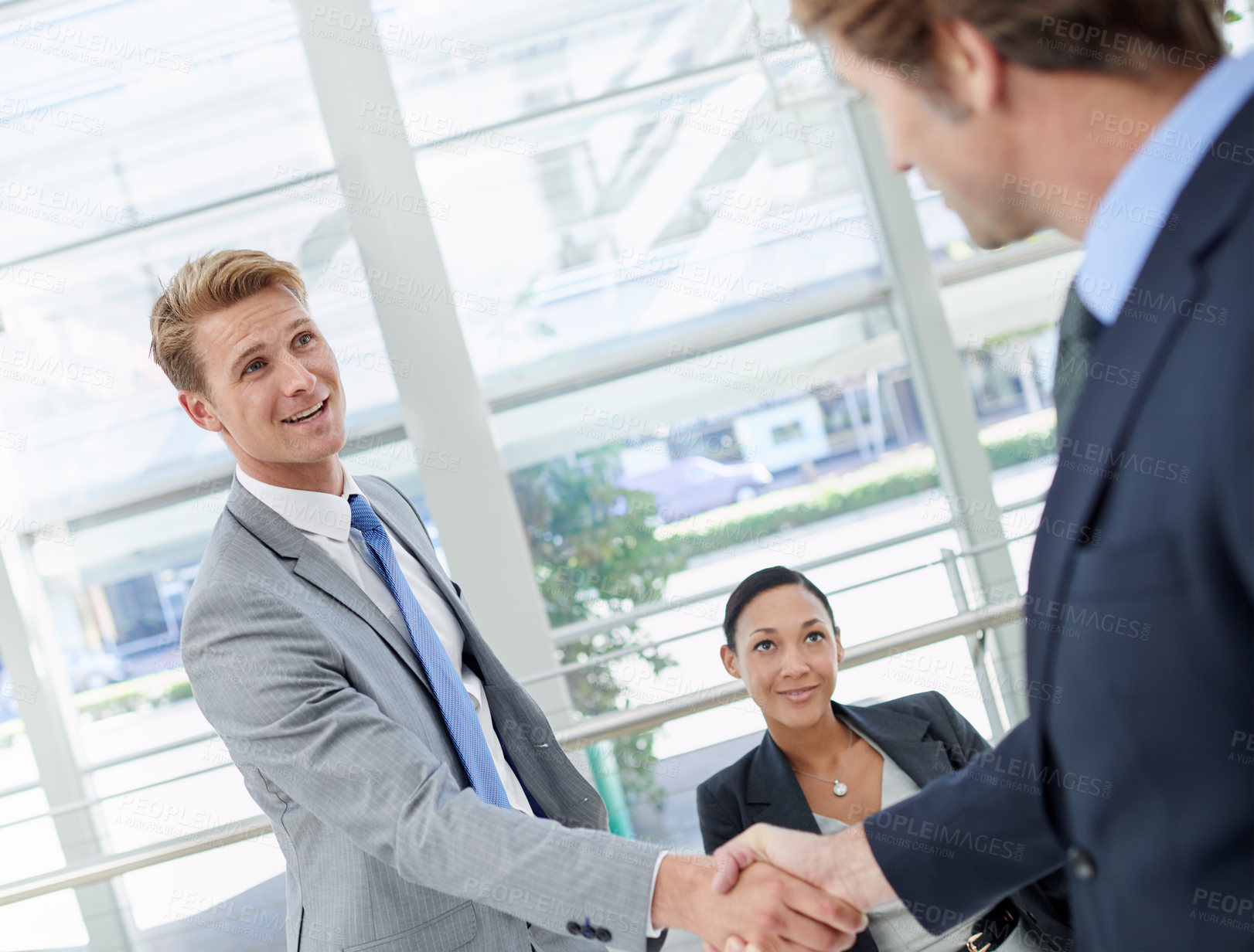 Buy stock photo Handshake, deal and business men in office for agreement, partnership or collaboration. Smile, meeting and professional people shaking hands with manager for onboarding or hiring welcome in workplace