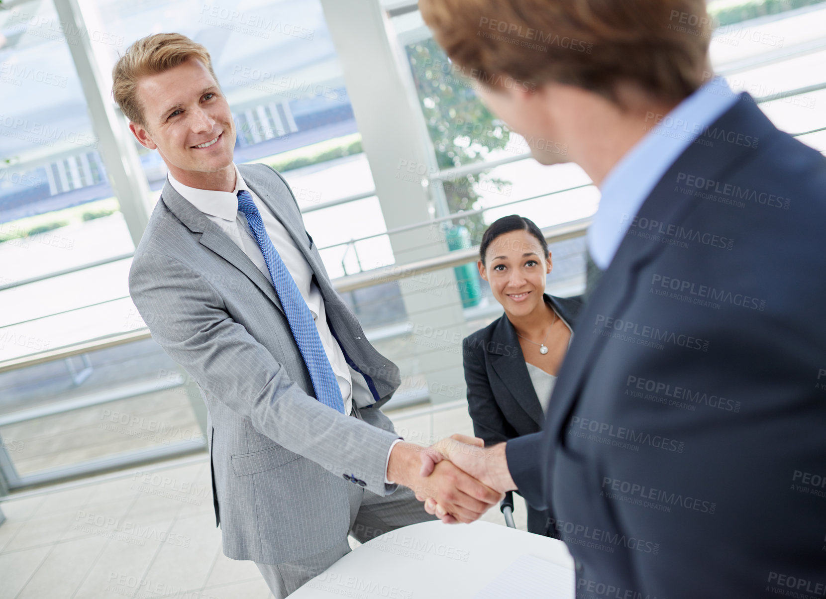 Buy stock photo Handshake, agreement and business men in office for deal, partnership or collaboration. Smile, meeting and professional people shaking hands with manager for onboarding or hiring welcome in workplace