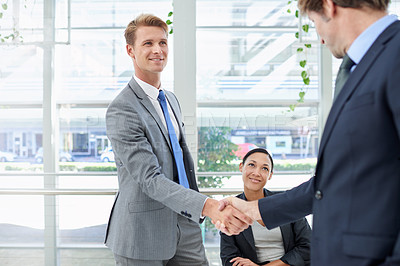 Buy stock photo Shaking hands, collaboration and business people in office for agreement, partnership or deal. Smile, meeting and professional men with handshake for onboarding or hiring welcome in workplace.