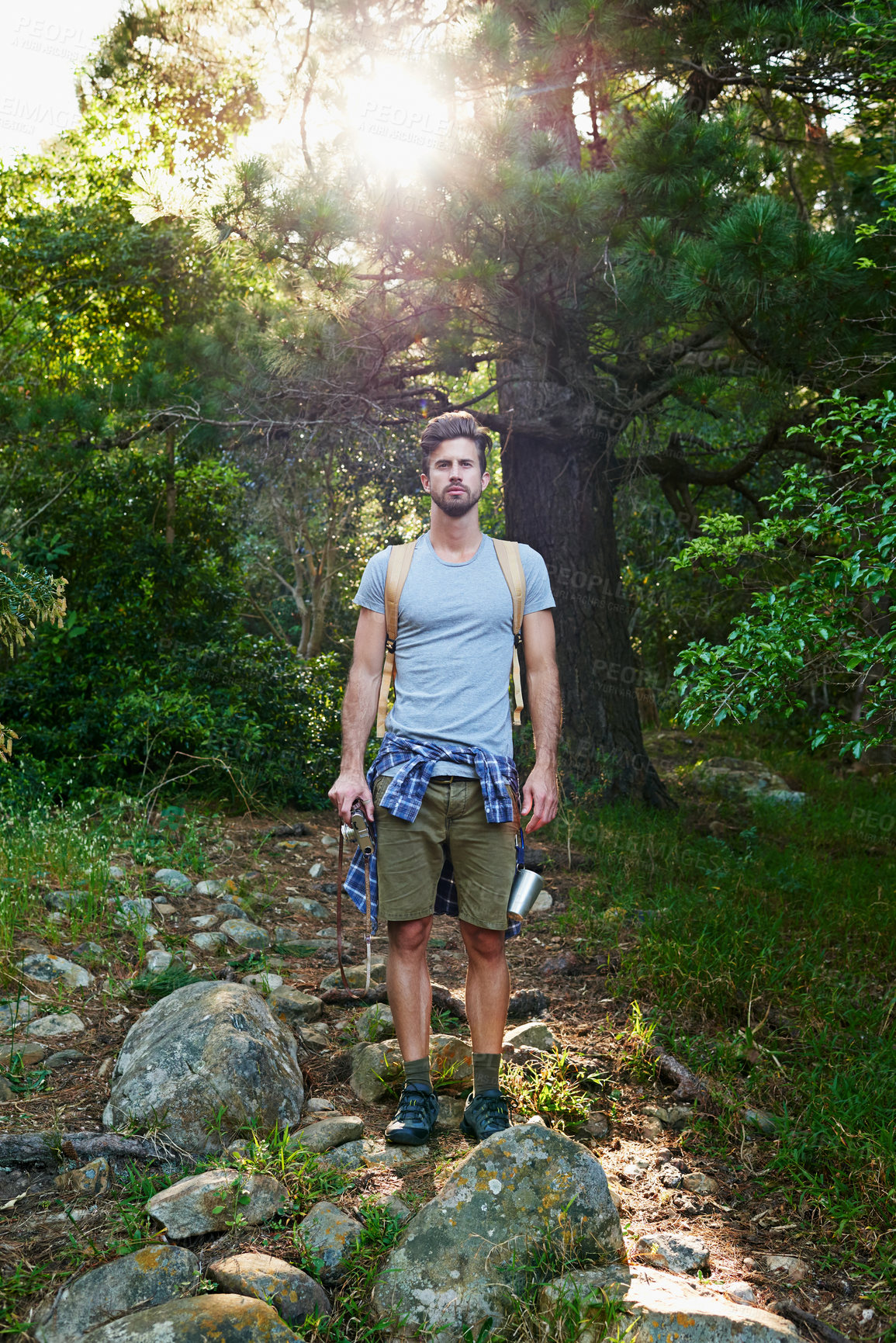 Buy stock photo Shot of a young outdoorsman on a hike