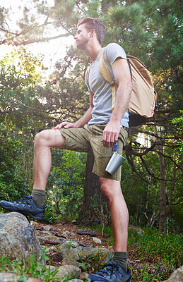Buy stock photo A young man looking at the nature around him