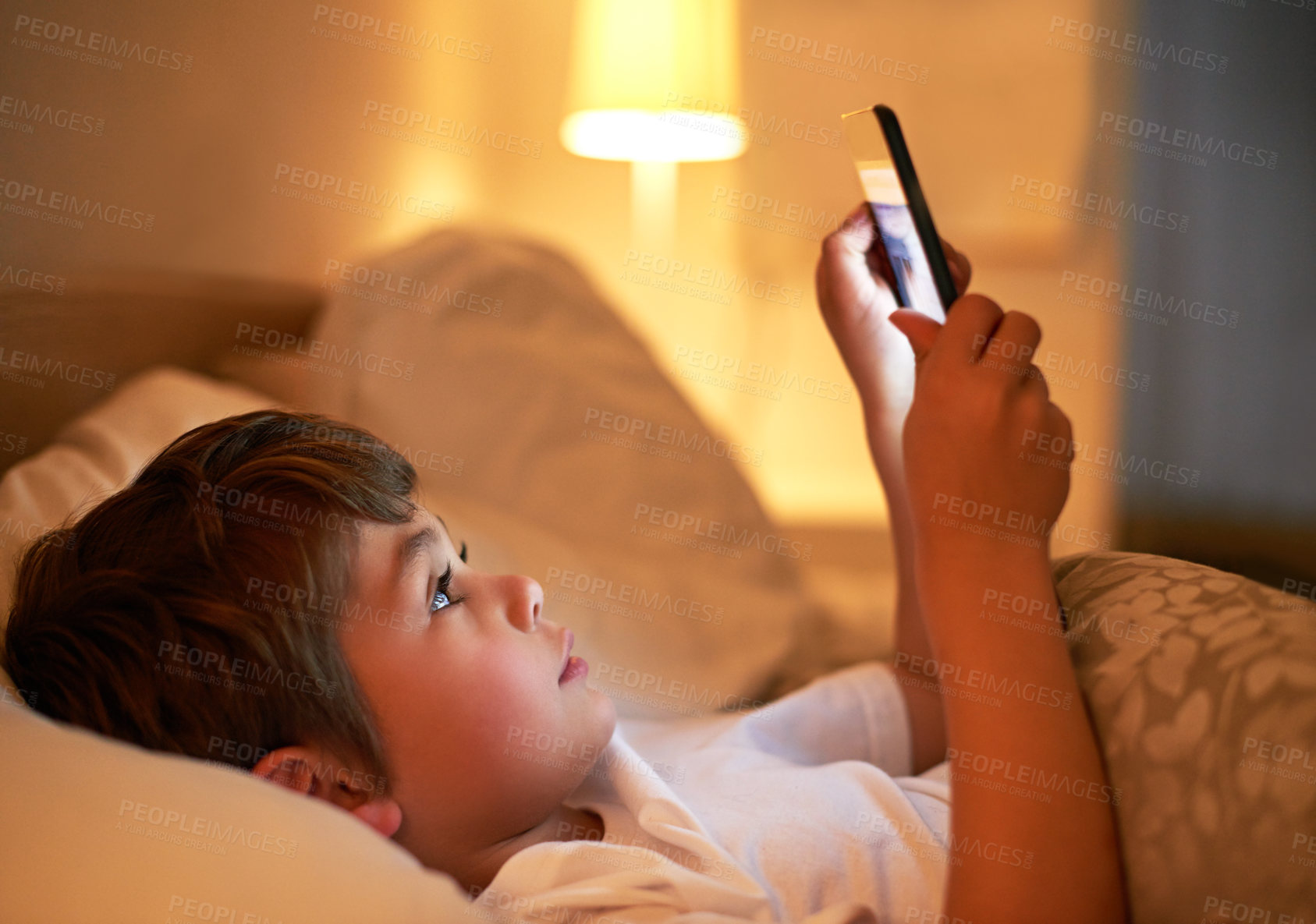 Buy stock photo Boy, tablet and bed with night, learning and technology for social media and growth. Child, bedroom and connectivity for knowledge, reading and elearning or internet surfing at home with touchscreen