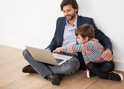 Buy stock photo Father, son and bonding in home with laptop for remote work with video streaming, online games or pointing on floor. Family, parent and child with technology on ground for relax, communication or fun
