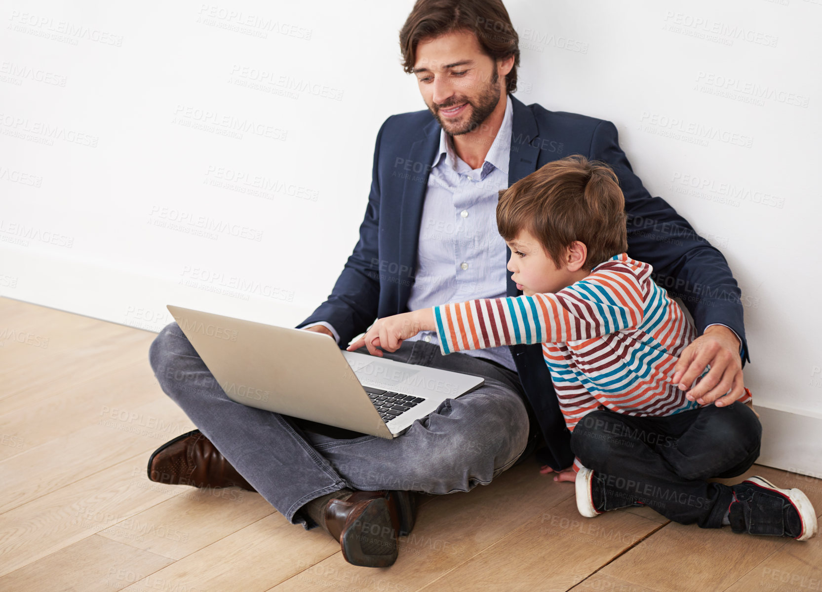 Buy stock photo Father, son and bonding in home with laptop for remote work with video streaming, online games or pointing on floor. Family, parent and child with technology on ground for relax, communication or fun