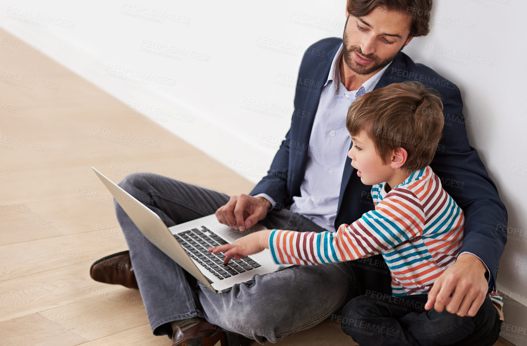 Buy stock photo Father, kid and laptop on floor for learning, online education and teaching boy at home. Child, dad and computer for internet, study and family typing information on keyboard for homework together