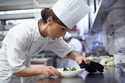 Buy stock photo Woman, chef and food in fine dining restaurant for cooking, hospitality and meal in kitchen. Female person, cook and professional service in hotel for dinner, nutrition and preparation in resort