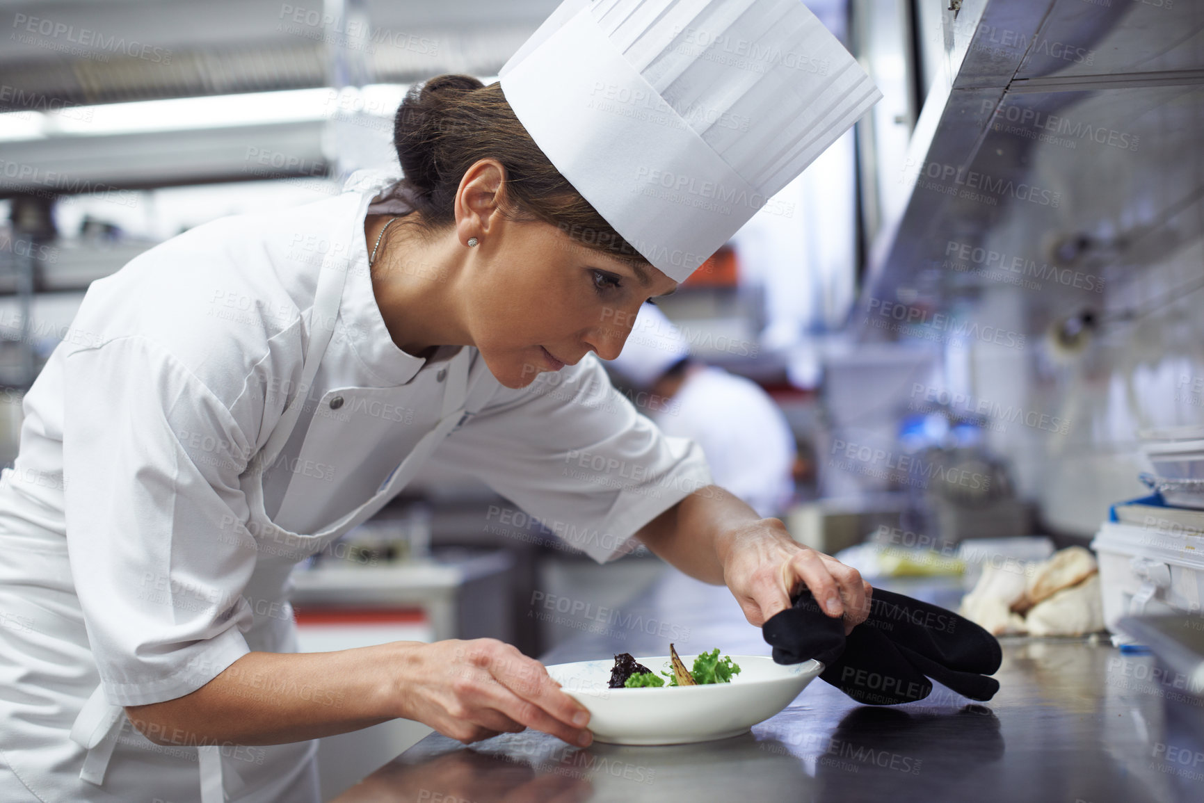 Buy stock photo Woman, chef and food in fine dining restaurant for cooking, hospitality and meal in kitchen. Female person, cook and professional service in hotel for dinner, nutrition and preparation in resort