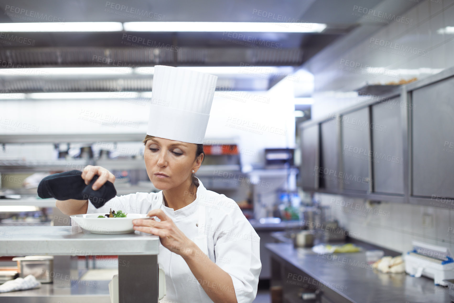 Buy stock photo Woman, chef and kitchen with dinner plate for hospitality presentation or cooking, cuisine or service. Female person, hat an fine dining food at professional restaurant, nutrition or small business