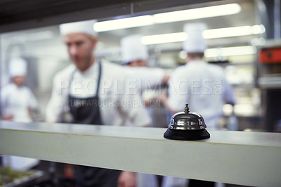 Buy stock photo Shot of chefs preparing a meal service in a professional kitchen