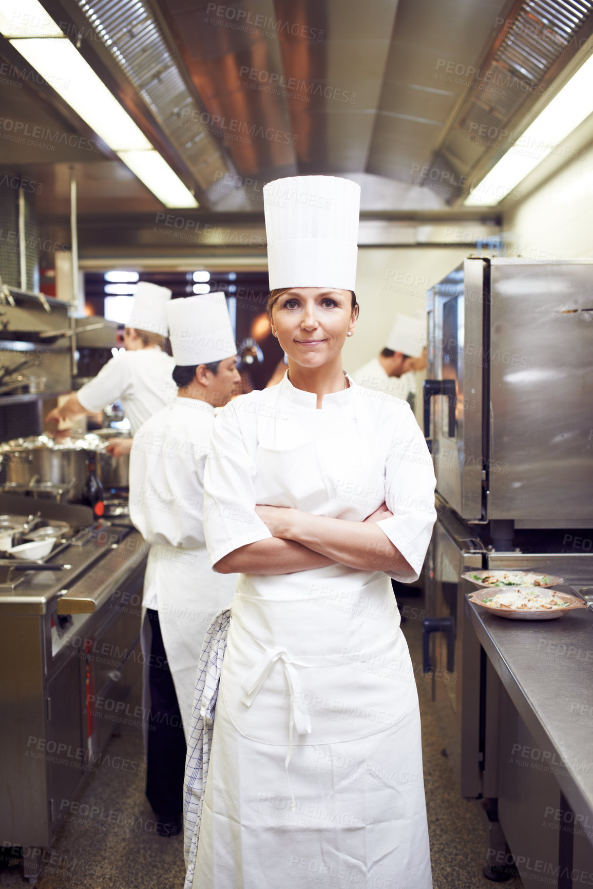 Buy stock photo Arms crossed, woman and portrait of chef in restaurant for hospitality service, cuisine and pride. Fine dining, kitchen and cook with confidence in food industry for culinary, job or catering career