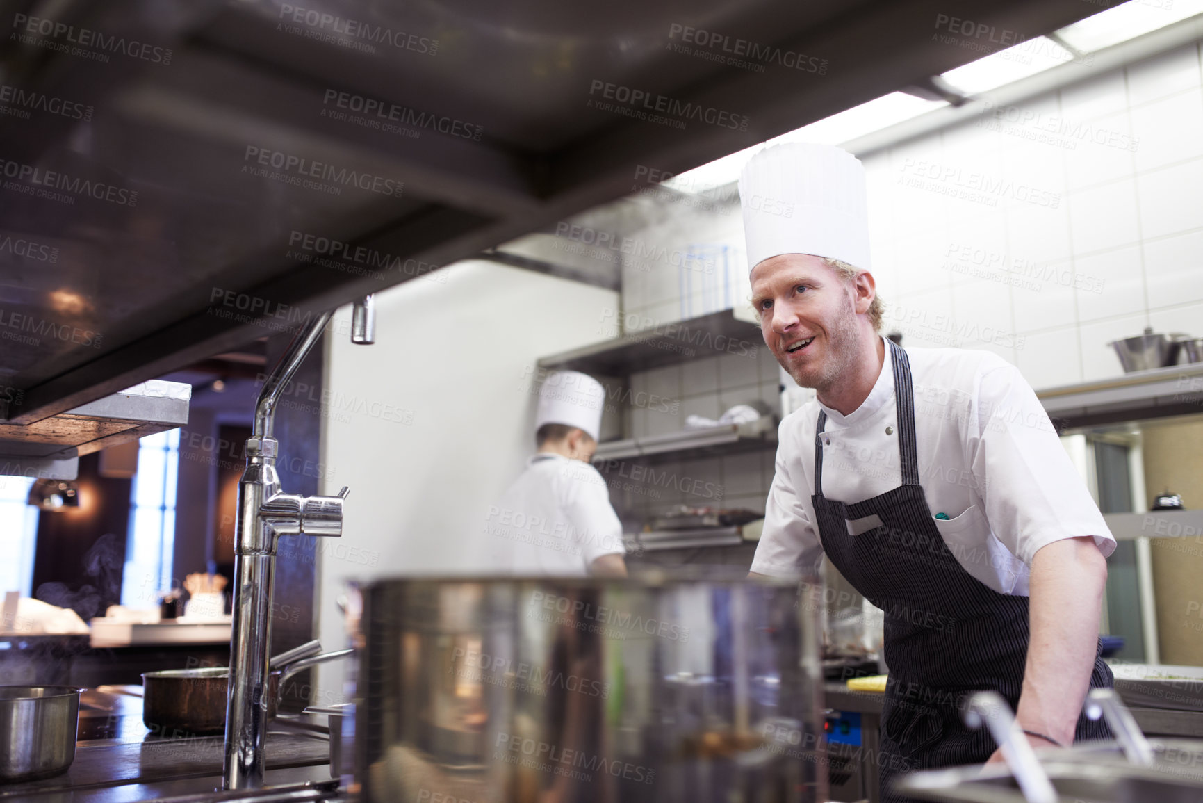 Buy stock photo Commercial, man and chef in a kitchen, service and order preparation for meal during dinner rush. Male person, restaurant and professional with planning, food industry and catering with hospitality