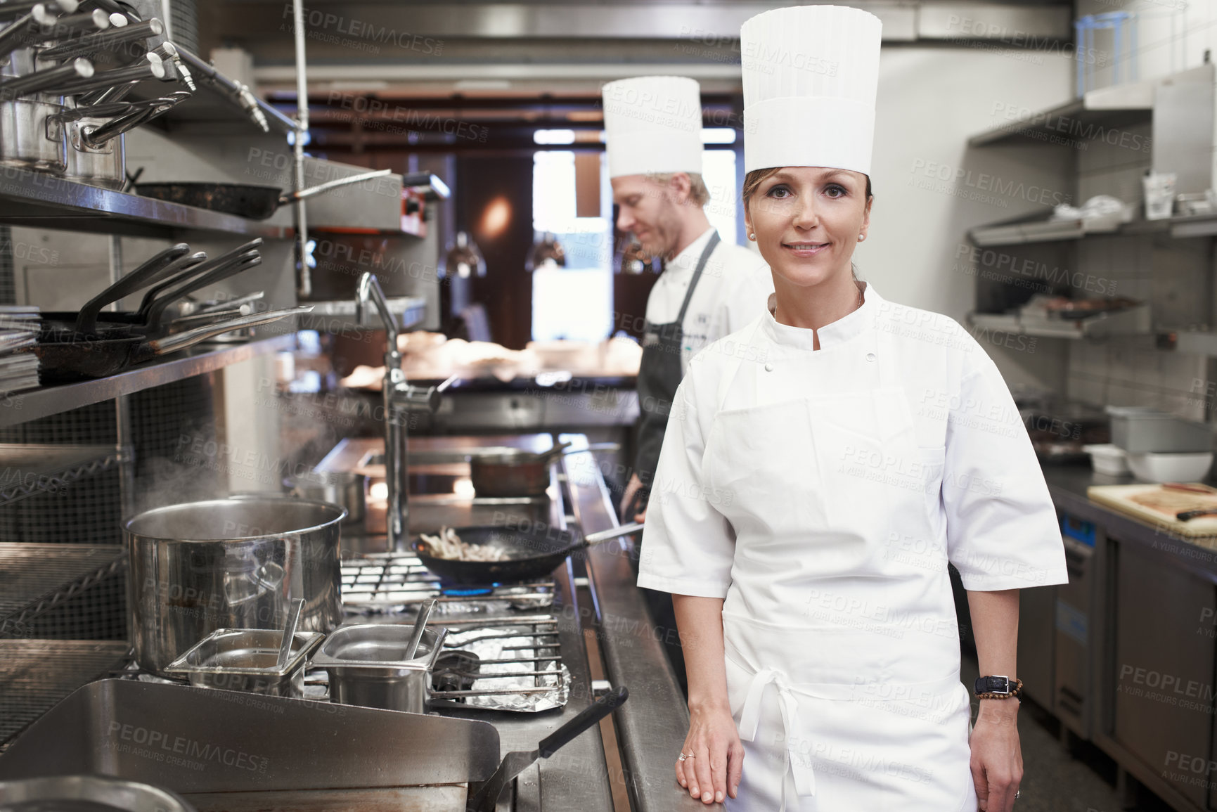 Buy stock photo Smile, chef and portrait of woman in kitchen for hospitality service, career and cuisine at restaurant. Fine dining, happy and face of cook in food industry for catering, culinary and job in Italy