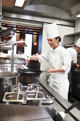 Buy stock photo Chef, woman and frying pan with sauce in restaurant kitchen, catering service and prepare food for fine dining. Professional, cooking and female saucier or person with meat meal for hospitality.