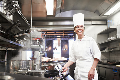 Buy stock photo Chef, woman and smile with frying pan in kitchen, catering service and prepare food for fine dining in restaurant. Professional, cooking and female person saute, cook and thinking about hospitality.