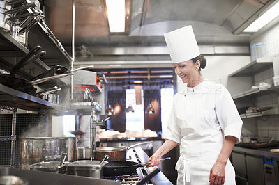 Buy stock photo Restaurant, cooking and a woman chef in the kitchen for luxury hospitality or preparation of a gourmet meal. Food, catering and a professional female cook working in the commercial service industry