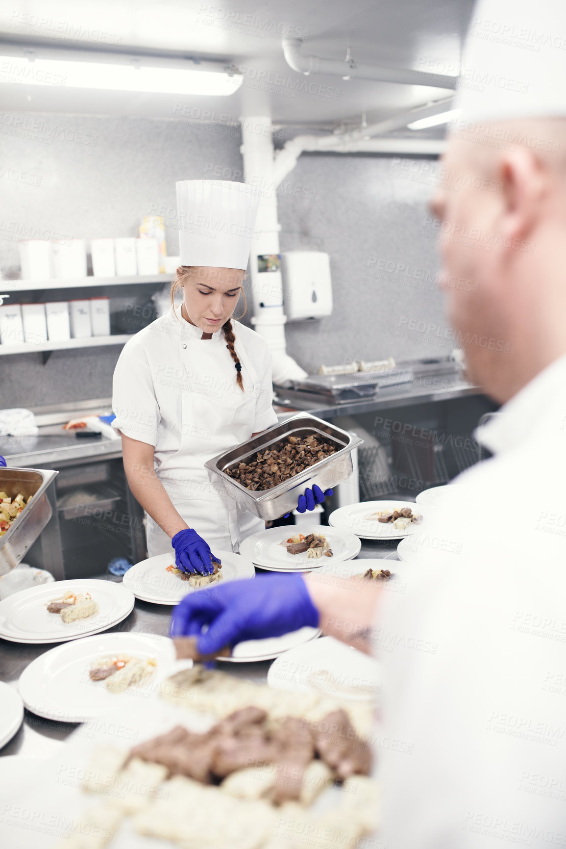 Buy stock photo Food, teamwork and chef in kitchen for fine dining, catering service or nutrition dish. Hospitality, professional and coworker people for cooking meal, preparation or dinner rush in restaurant