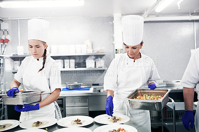 Buy stock photo Chef, food and a woman cooking in the kitchen of a restaurant for luxury hospitality or nutrition. Catering, service and dinner with a female cook working in the service industry for healthy cuisine