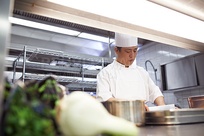 Buy stock photo Professional, chef and asian man in kitchen for catering, cooking and serving food in restaurant. Business, culinary or male expert with cookware for hospitality, service and culinarian in uniform