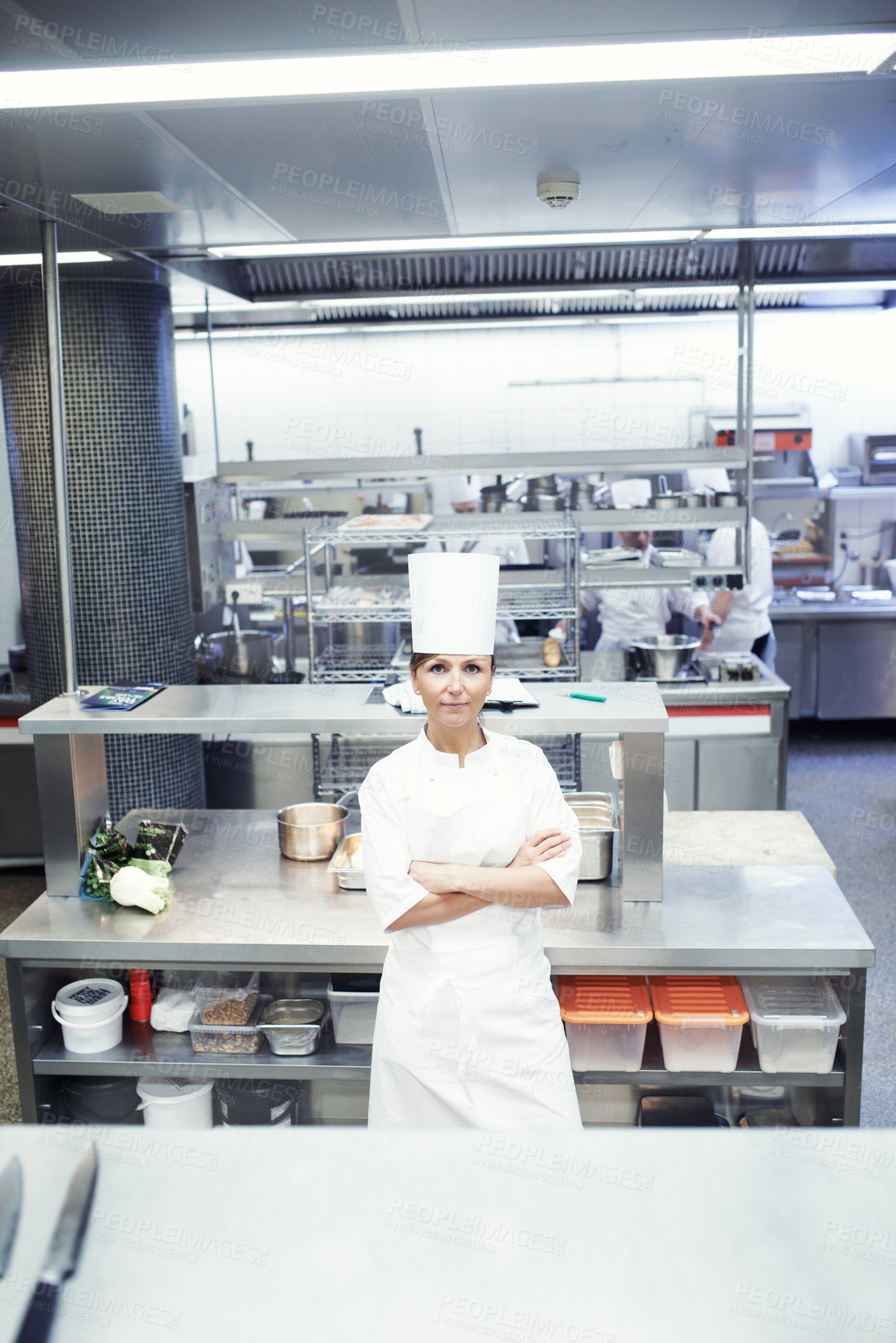 Buy stock photo Woman, portrait and arms crossed as chef in kitchen for professional service, culinary or food industry. Female person, face and cuisine cooking in gourmet restaurant as career, catering or confident