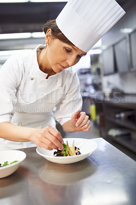 Buy stock photo Chef, plate and hands of woman in kitchen for catering service, fine dining or prepare dish. Hospitality, presentation and female person for cooking meal, food industry or dinner in restaurant