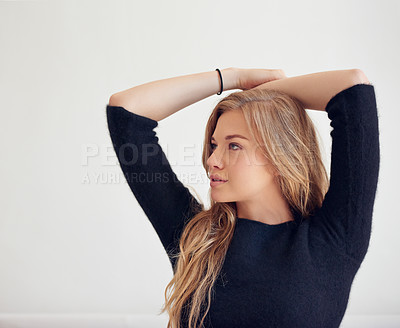 Buy stock photo Shot of a beautiful woman posing indoors