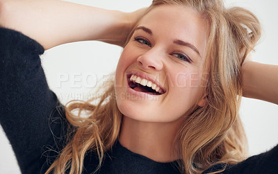 Buy stock photo Portrait of a beautiful young woman playing with her hair