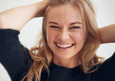 Buy stock photo Portrait, laughing or happy woman with hair care, beauty or funny face for healthy growth in studio. Humor, white background or girl with smile, joke or treatment for scalp cosmetics in Australia