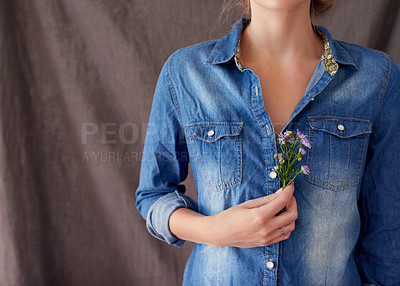 Buy stock photo Cropped shot of a woman holding cut flowers