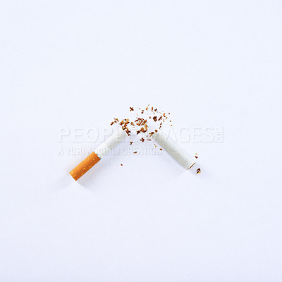 Buy stock photo A broken cigarette on a white background