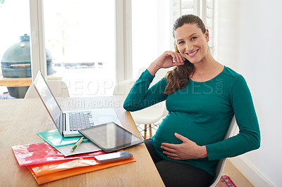 Buy stock photo Portrait of a pregnant woman sitting with her laptop at home