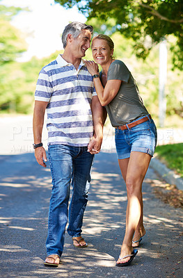 Buy stock photo Full length shot of an affectionate mature couple enjoying a day in the park